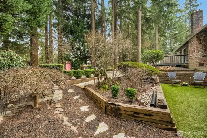 The backyard is fully fenced and features beautiful paths & a turfed play space that stays dry & green all year round.