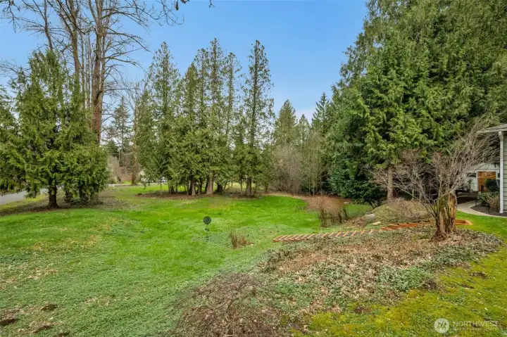 The lower two parcels are home to natural grasses, cedar trees, grape vines & blueberries. Custom outdoor stairs were added for charm & ease.