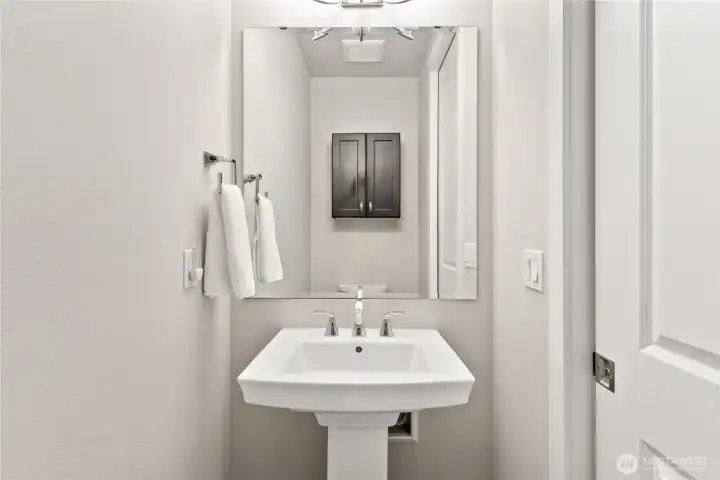 Convenient half bath for guests to use.