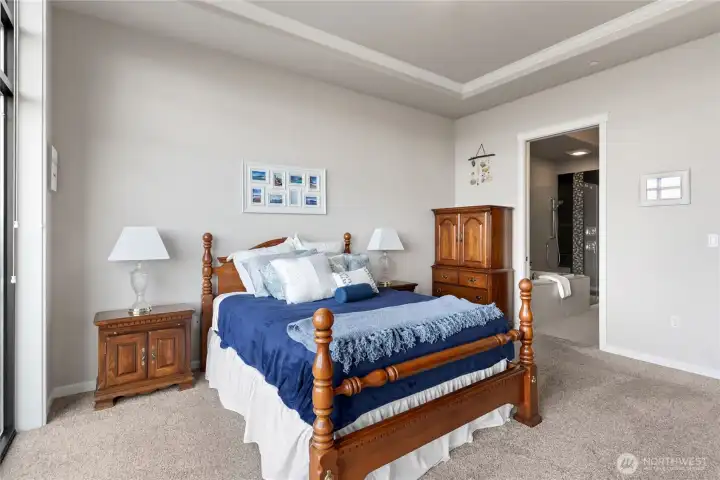 Large primary bedroom with beautiful sunlight in the mornings.