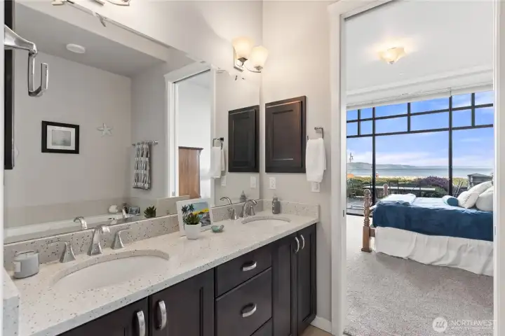 Double vanity in bathroom off primary suite.