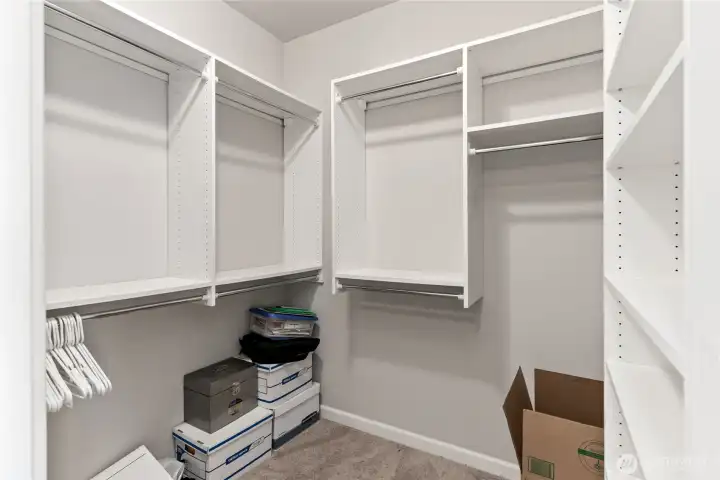 Walk in closet in the primary suite.