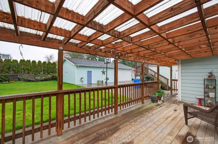 Rear deck looking out on backyard and shop