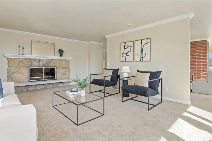 Upper level living room with wood burning fireplace