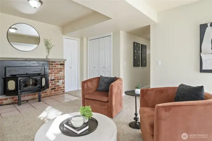 Large family room with pellet stove and access to the backyard