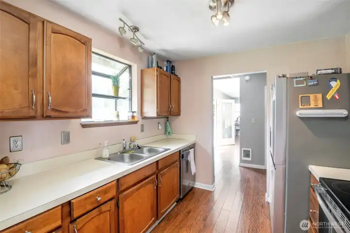 Pass thru kitchen separates the larger living spaces