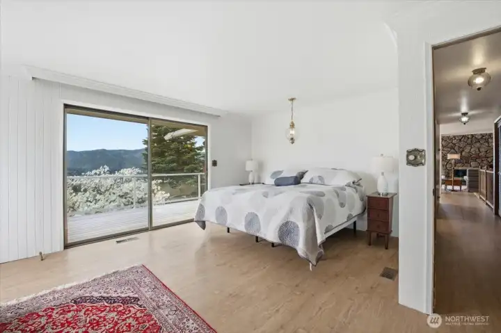 Primary bedroom with slider to view deck