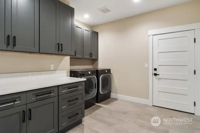Laundry with Access to the Garage.  Energy Efficient Washer/Dryer.  Nice Size Sace. Excellent Storage.