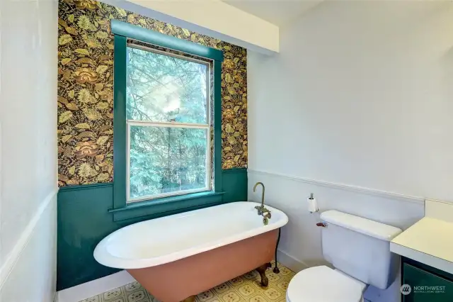 Primary bathroom with claw-foot tub.