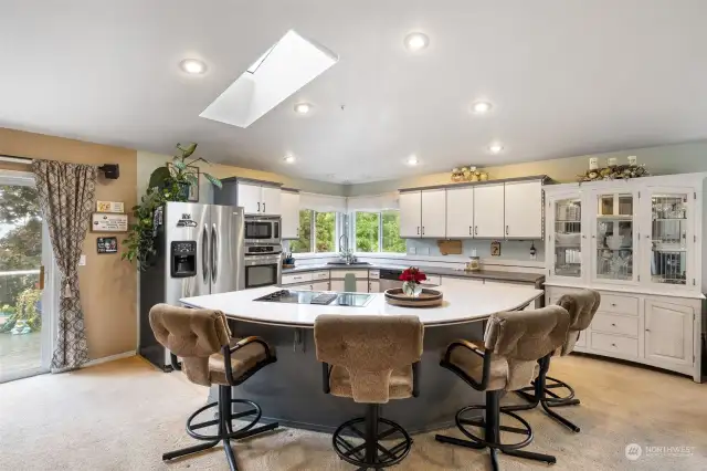 Massive island with Corian counter tops.