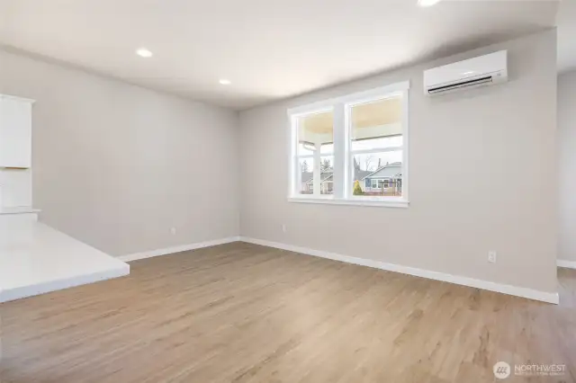 The dining room is very spacious and will fit a large table.