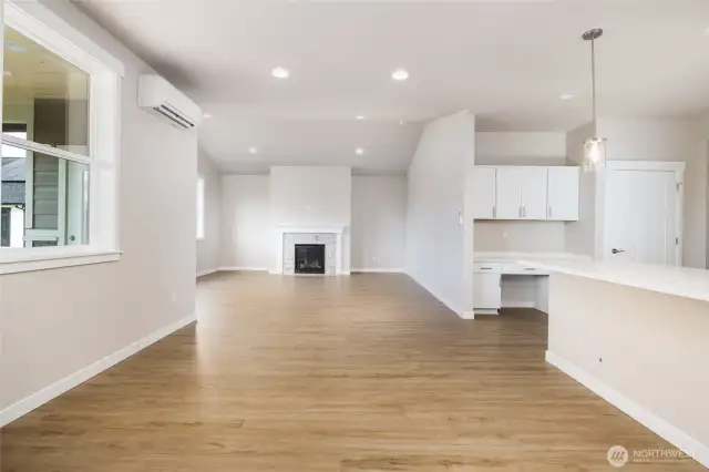 Open floor plan in the great room/dining room, kitchen area all with LVP (luxury vinyl plank flooring).
