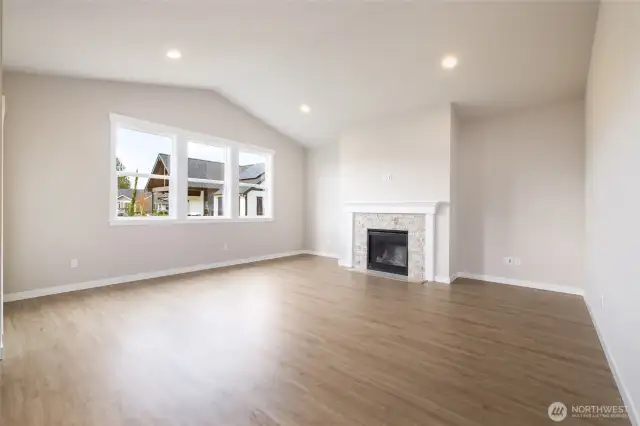 Lots of glass and light in this home with taller ceilings & some taller ceilings.