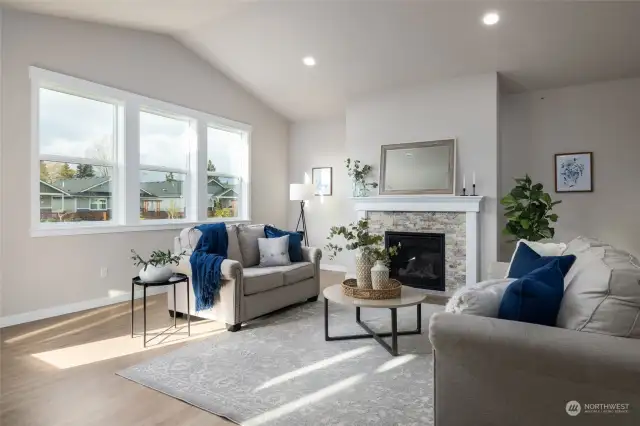 Staged pic of other home. The great room has vaulted ceilings and a gas fireplace.
