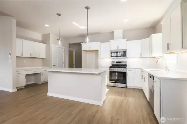 The kitchen has a stainless d/w, & range with micro hood.