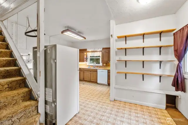 Pantry area and entrance to upstairs bedrooms