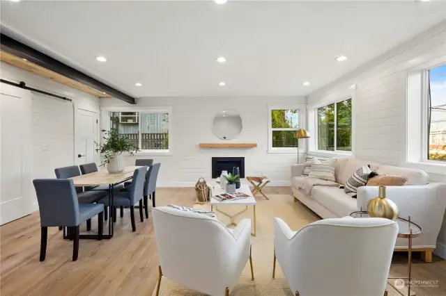 Sunlit family room with shiplap detail and cozy gas fireplace