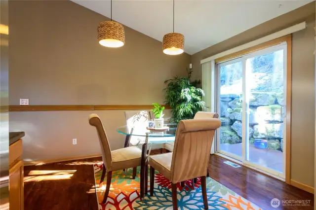 Formal dining area off of kitchen with slider out to the private back yard and deck.