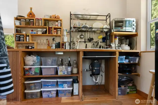 Shelving units above and beside the sink can stay with the cabin.