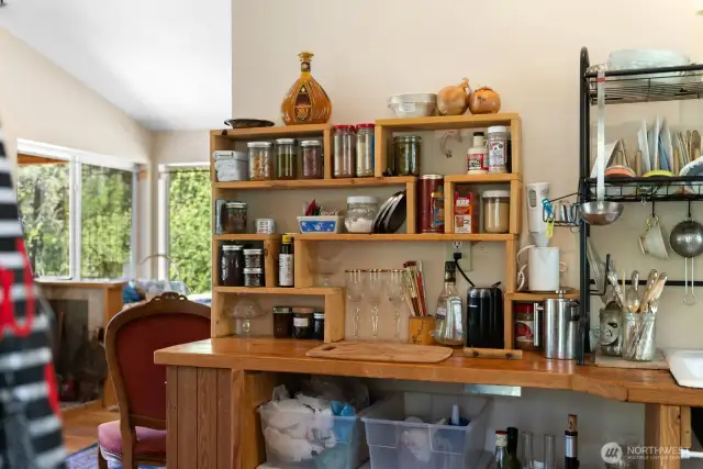 Visually separated from the sleeping area, it's easy to be in the kitchen and interact with people in the living area of the cabin.