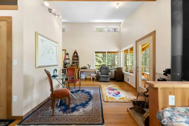 The built-in day bed, the central wall, and the window corner naturally divide the main living space into three sections creating definition with easy flow.