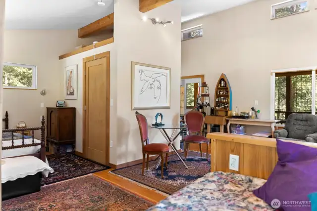 Practical u-shaped layout holds the 3/4 bath in the center of the space.