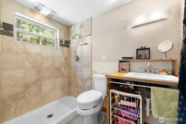 Efficient 3/4 bath tucked into the center of the cabin.
