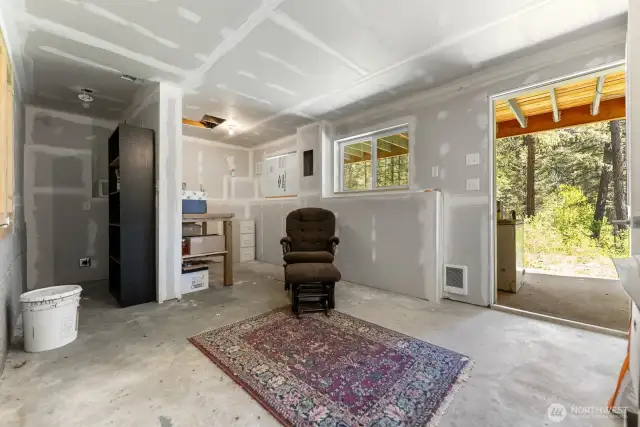The cool (temperature) basement is perfect for summer projects or even summer sleeping. There is heat if you wish to make it warm in the winter. Hookups for a stackable washer and drier in the rear nook, and a sink plumbed into the front nook. Drain in the floor for easy cleanup.