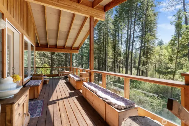 The welcoming covered porch is a wonderful place to spend an afternoon soaking in the sounds of Libby Creek.