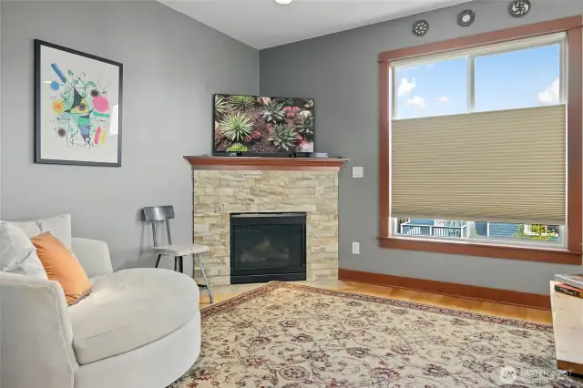 Living room has a cozy fireplace for those cool evenings after a dip in your own hot tub in the backyard!