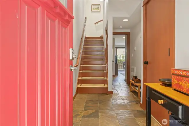Entry level is garage (door to right) and a very good sized bedroom with an en-suite.  Currently being used as an office.  Entrance to back yard is off the office!