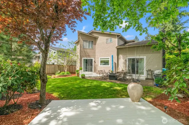 This peaceful, private backyard is perfect for both relaxation and entertaining. Whether enjoying a quiet evening or hosting a lively gathering, this outdoor space offers comfort and charm.