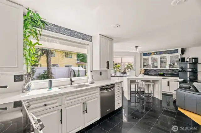The kitchen shines with modern updates, featuring elegant granite countertops and sleek stainless steel appliances—perfect for both style and functionality.