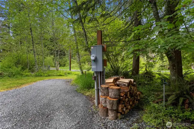 RV space 1 & firewood pile.