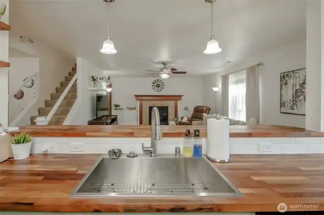 From the kitchen, enjoy a clear view into the living room—perfect for staying connected while cooking or entertaining in this open-concept space.
