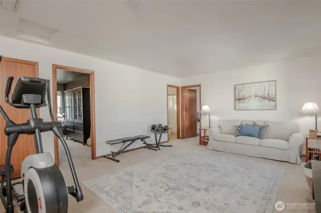 The spacious upstairs bonus room is a blank canvas for your needs—whether it's a home gym, playroom, game room, or anything you envision!