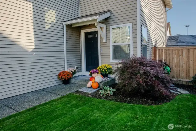 Admire the beautifully maintained front yard, featuring a lush, vibrant green lawn!