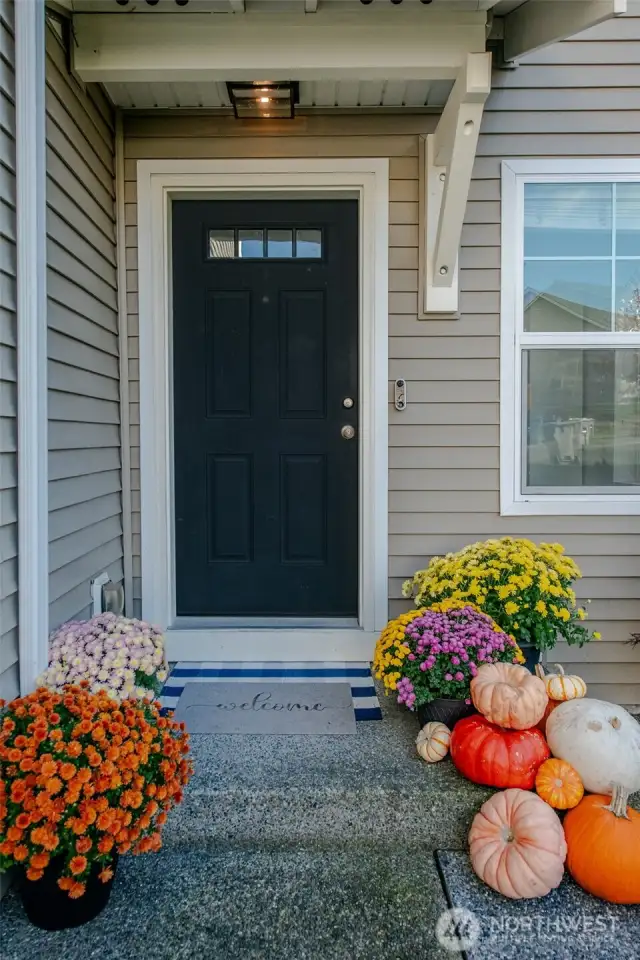 Step into the home through a charming covered porch!