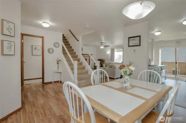 To the left, you'll find a spacious coat closet and a convenient half bathroom. The dining area sits just off the kitchen, making it perfect for effortless entertaining!