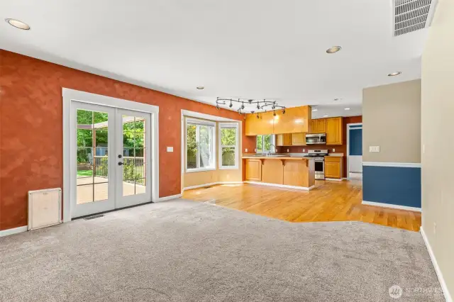 Family Room View To Dining Space & Kitchen