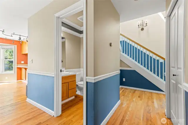Hallway View To Staircase & Half Bathroom