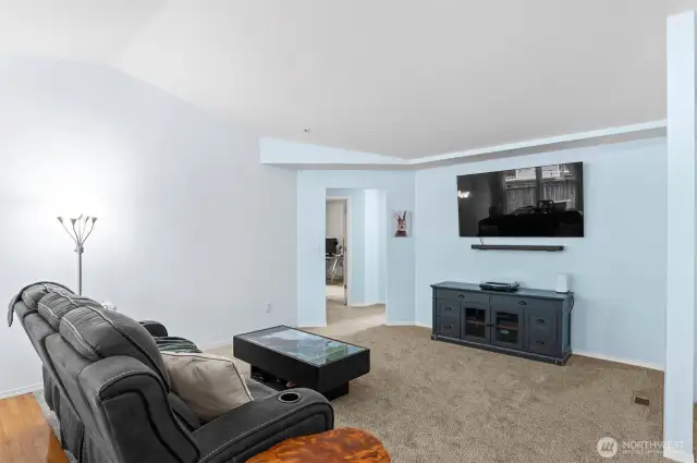 Relax or entertain in this spacious living area, completely refreshed with new interior paint and plush new carpeting.