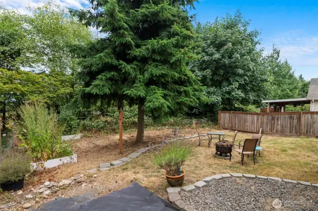 Escape to a private, peaceful backyard, ideal for summer BBQs and family gatherings.