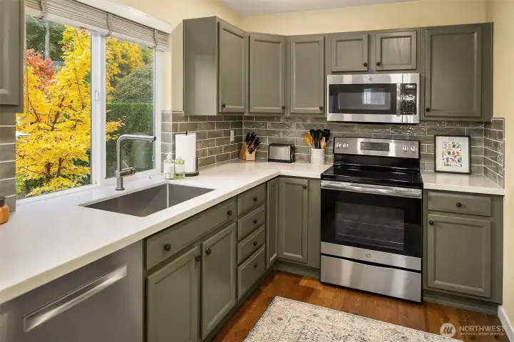 Kitchen with new countertops, back splash, and appliances