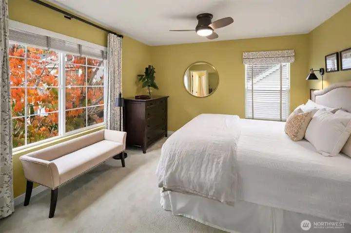 Primary Bedroom with custom blinds and curtains included