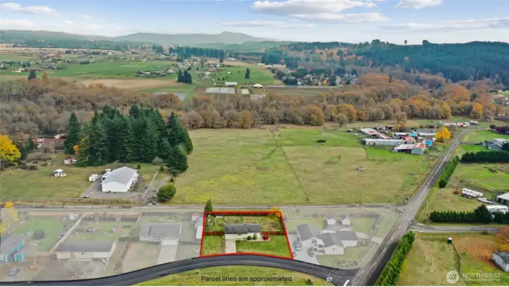 Aerial with subject property highlighted in foreground.  property lines approximate.