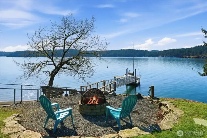 Sunny waterfront firepit ideal for crisp spring days and evening gatherings