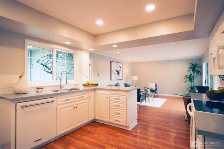 Modern kitchen features new quartz countertops and loads of storage