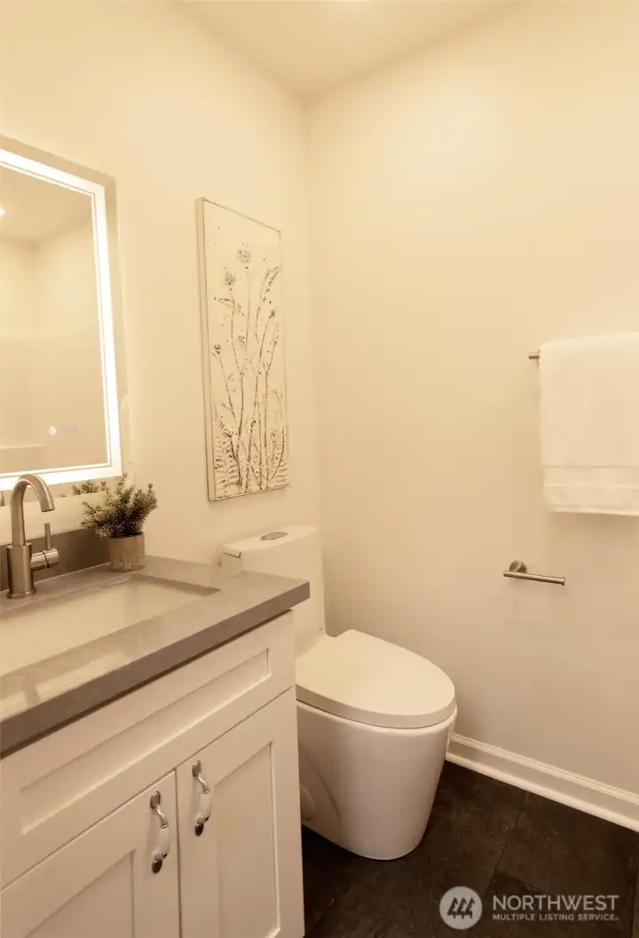 Slate floors in mudroom full bathroom, perfect for cleaning up after a day on the lake!