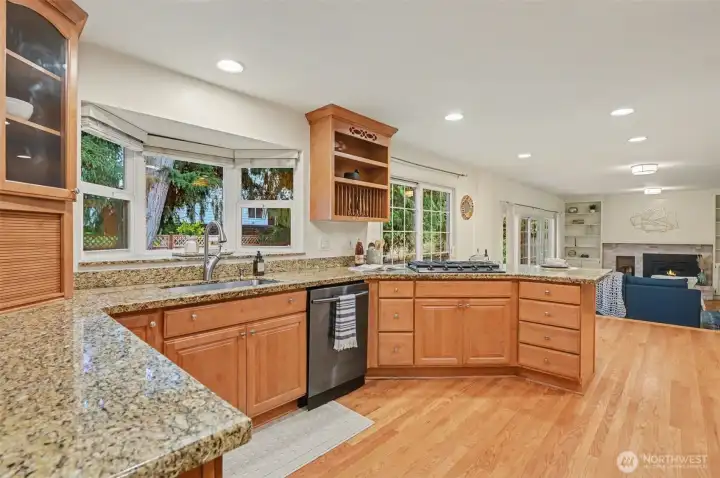 Chef's kitchen with slab granite and stainless appliances
